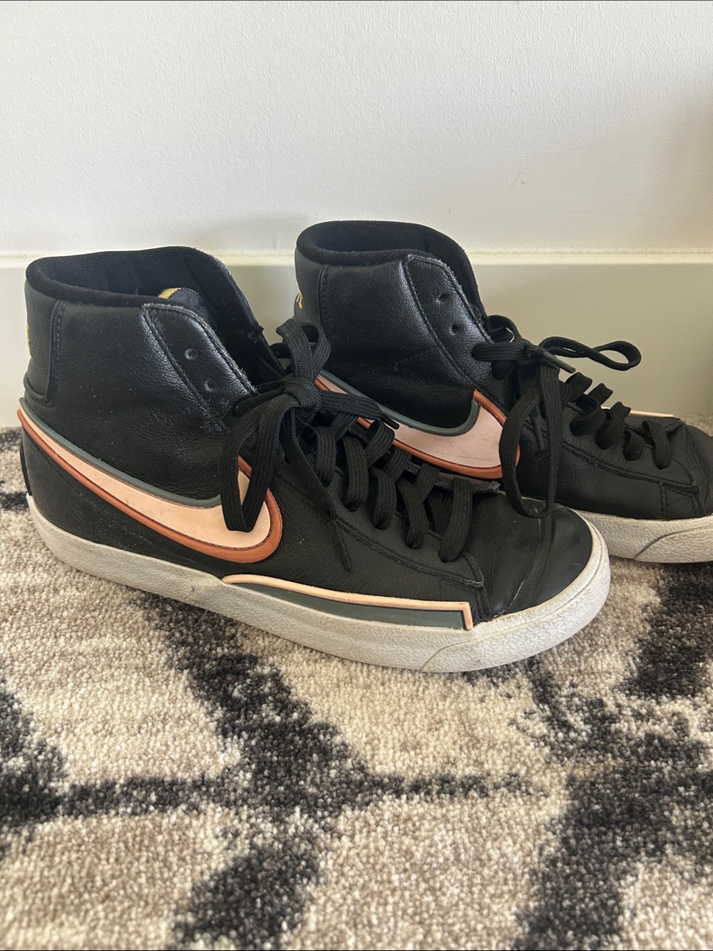 Nike Women's Black High-Top Sneakers with Peach Swoosh
